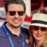 Adam Martin- Adam and Anne Standing in Front of a Mille Miglia Event